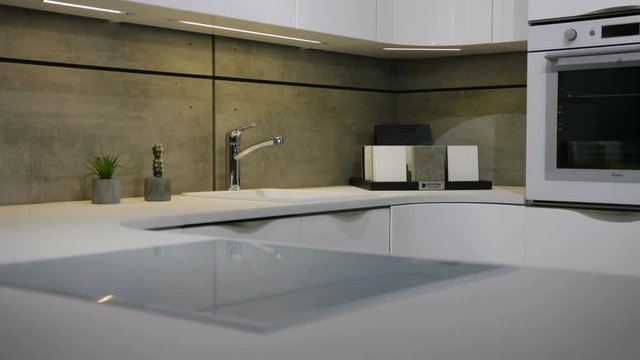 Close up view of white stylish plase for the cooking at the kitchen in the modern style.