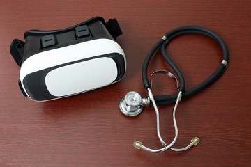 Virtual reality goggles next to stethoscope