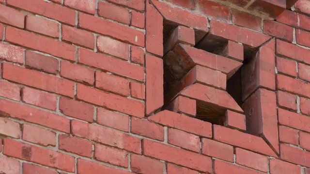 Decorative and ornamental brickwork in Bopiliao Historical Block, a historical street in Taipei's old Wanhua District, Taiwan. The red brick facade is a predominant throughout the street. 