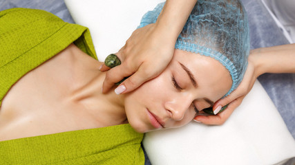 Obraz na płótnie Canvas Spa treatment. Massage with jade stones