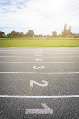 Gray treadmill at the stadium with the numbering from one to eight