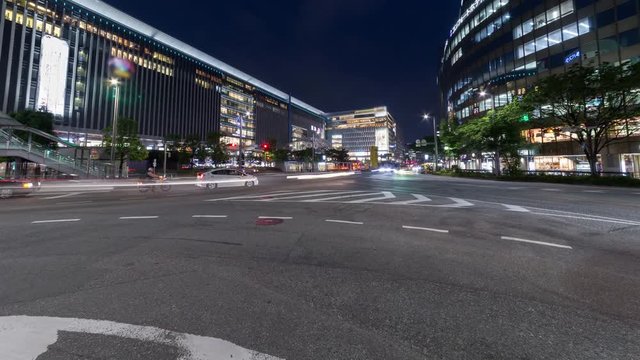 Time lapse of long exposure of car light trail and illuminated building, urban scene
