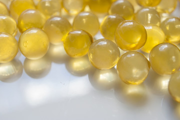 Background: Fish oil capsules are yellow.