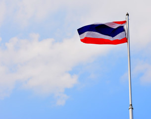 Fototapeta na wymiar The National Flag of Thailand on blue sky background