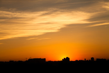 Fototapeta premium Sunset in the city beyond the horizon from the height