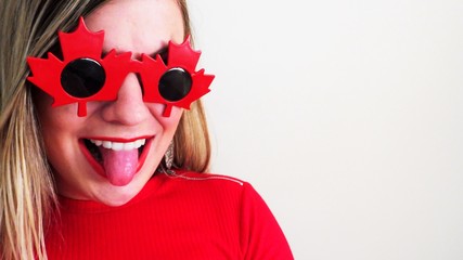 Happy young woman celebrating Canada Day, 150th Anniversary