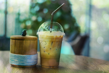 Iced espresso on the table with bokeh abstract background