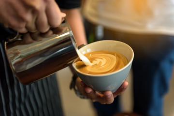 Fototapeta na wymiar Coffee latte art in coffee shop