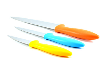 Set of colorful kitchen knives on white background