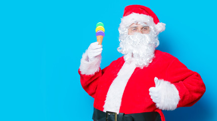 Funny Santa Claus have a fun with ice-cream