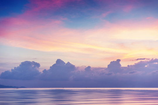Fototapeta Sunset on the shore of the tropical sea, long exposure and retro toning