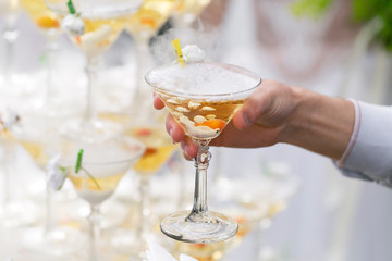 people take the glasses of champagne pyramid. close-up