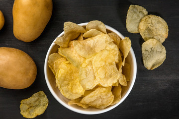 Chips with potatoes, shot from above with copyspace
