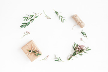 Fototapeta na wymiar Flowers composition. Gifts, pink flowers and eucalyptus branches on white background. Flat lay, top view