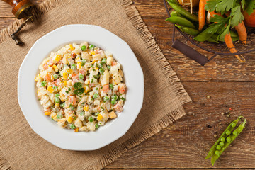 Traditional salad with cooked vegetables with mayonnaise.