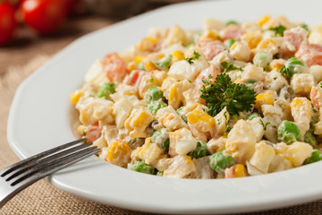 Traditional salad with cooked vegetables with mayonnaise.