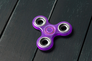 spinner on a wooden table. close up
