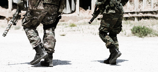 soldier walk with boots and rifles 