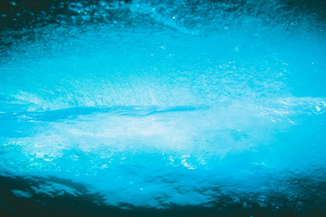Fototapeta na wymiar Blue wave underwater in ocean. Clear barrel wave