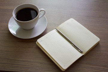 Obraz na płótnie Canvas Coffee and notepad