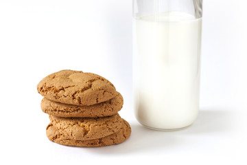 Some homemade cookies and bottle fresh milk