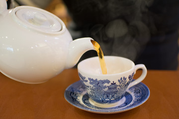 Pouring Tea in China Cup