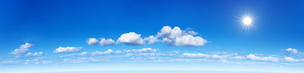 Fototapeta na wymiar Panorama of a blue sky with clouds and sun