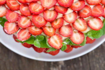 strawberry cake on wooden surface