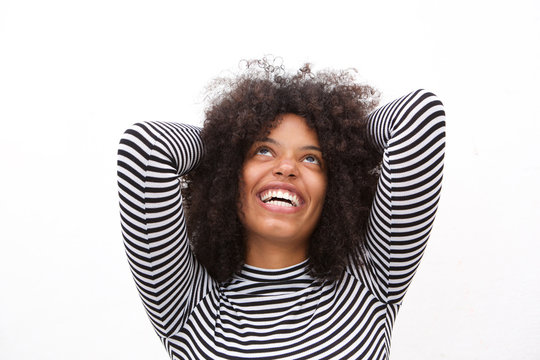 Close up relaxed laughing woman with arms behind head