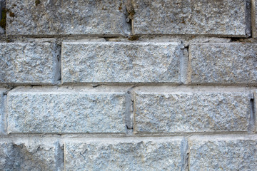 Grey brick wall. Closeup. Background
