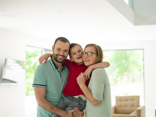 family with little boy enjoys in the modern living room