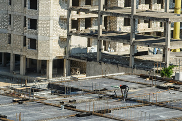 Fototapeta premium Construction worker working hard on a construction site.