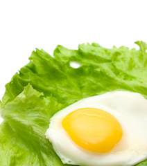 Fried eggs and lettuce copy space