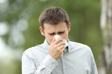 Man blowing in a wipe outdoors