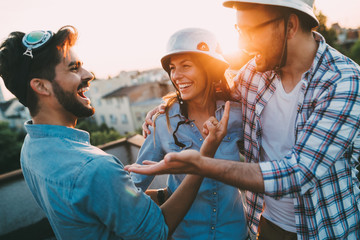 Happy cheerful friends spending fun times together