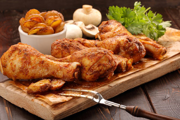 Roasted chicken legs with potato chips