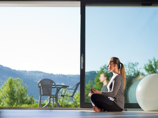 young woman doing morning yoga exercises