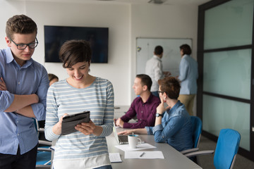 Two Business People Working With Tablet in office
