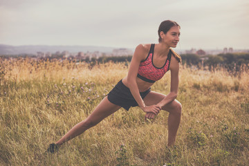 Beautiful woman exercising outdoor.