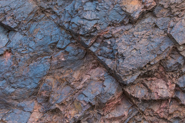 Iron ore texture close up - natural minerals in the mine. Stone texture of open pit. Extraction of...