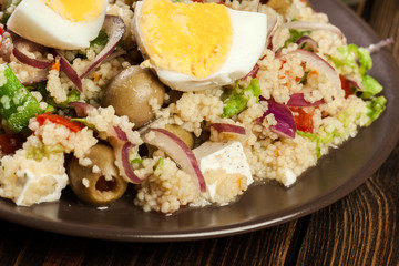 Fresh salad with couscous and eggs