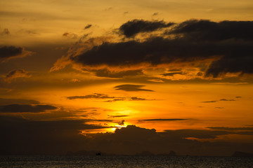 Fototapeta na wymiar Wonderful dramatic sunset over the sea water , Thailand