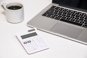 Laptop computer with calculator and coffee - パソコンと電卓とコーヒー