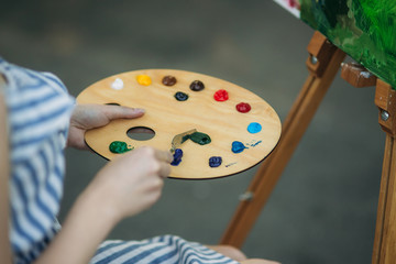 Palette with paints and spatula