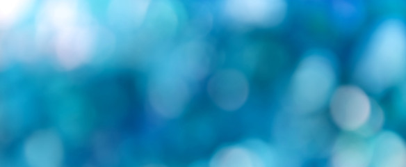 Abstract light blue bokeh panoramic (header) background