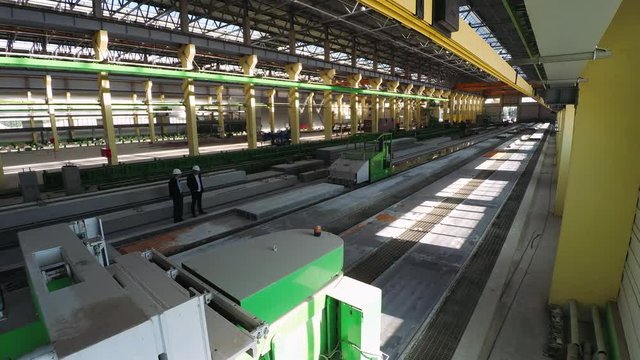 Plant for the production of concrete blocks, view of the cement plant hangar. Timelapse.
