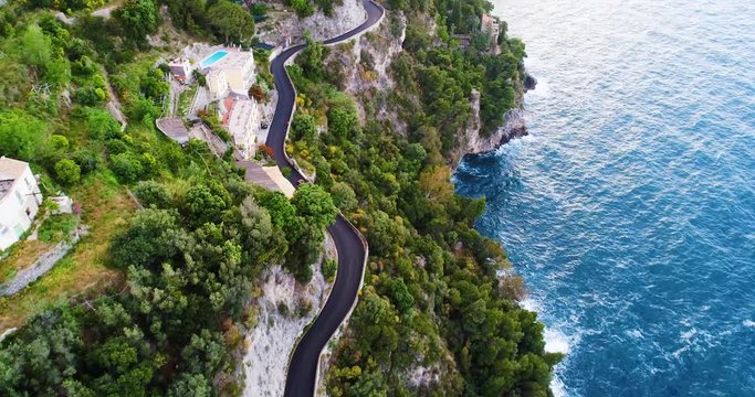 red sport convertible car moving in Amalfi coast