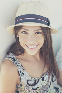 Portrait of young woman with sun hat