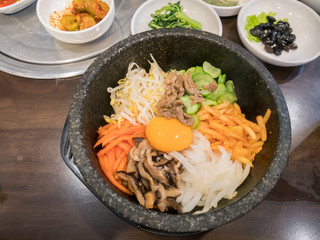 bibimbap in hot pot with side dish