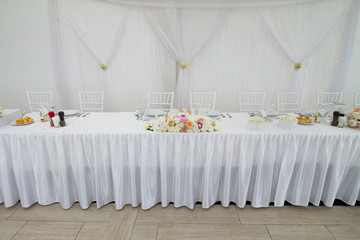 table set for wedding dinner decorated with flowers